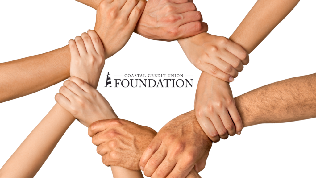 Seven Clasped hands in a circle, holding on to the other's wrist. Coastal Credit Union Foundations logo is in the center.
