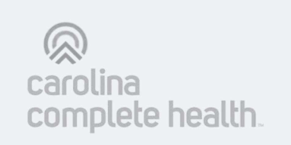 Gray Carolina Complete Health logo with stylized circular arrow icon above the company name on a light gray background.